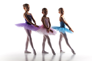 Image showing Three little ballerinas dancing in dance studio