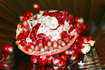 Image showing broken ripe and red pomegranate