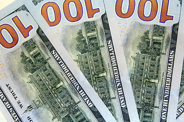 Image showing reverse side of hundred dollar bank notes