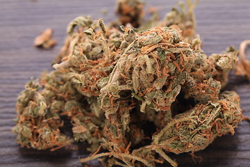 Image showing Close up Dried Marijuana Leaves on the Table