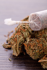 Image showing Close up of dried marijuana leaves and joint