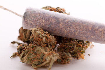 Image showing Close up of dried marijuana leaves and joint