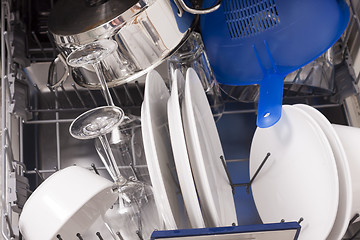 Image showing Dishwasher loades in a kitchen with clean dishes