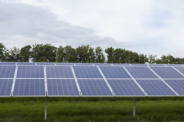 Image showing Field with blue siliciom solar cells alternative energy