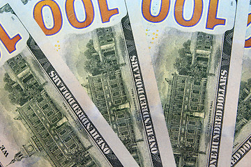 Image showing reverse side of hundred dollar bank notes