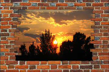 Image showing broken brick wall and view to the sunset