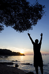 Image showing Man saluting sun at Adriatic sea