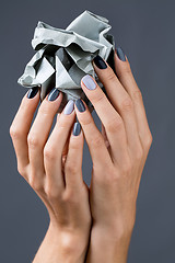 Image showing Stylish manicure in shades of gray female elegant handles.