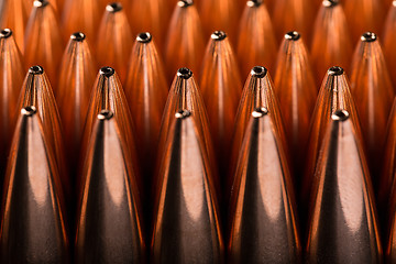 Image showing Macro shot of copper bullets that are in many rows 