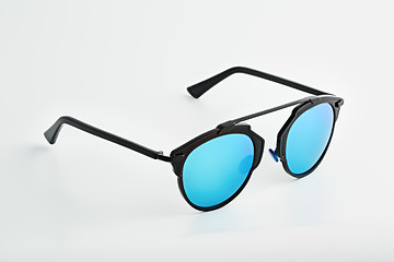 Image showing Stylish glasses with blue tinted mirror