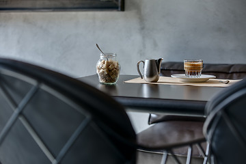 Image showing Espresso on black glossy table