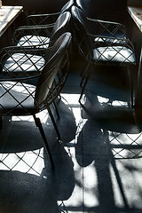 Image showing Shadow of beautiful chairs on the floor