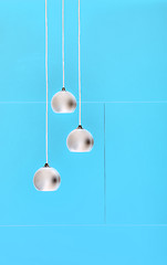 Image showing Blue negative collage of three ceiling lights, loft-style interi