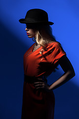 Image showing Contrast portrait of sexy blonde in a red hat