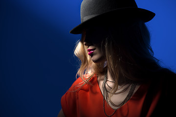 Image showing Contrast portrait of sexy blonde in a red hat