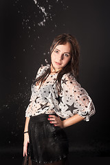 Image showing Attractive woman in wet dress with falling water