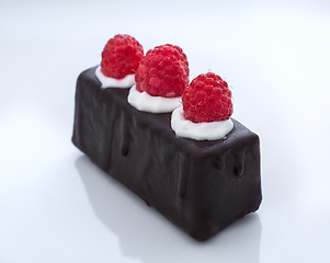 Image showing chocolate glaze cake with raspberry