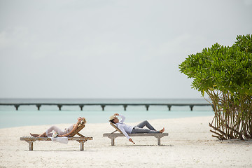 Image showing couple on the sun loungers