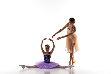 Image showing The little ballerina dancing with personal ballet teacher in dance studio