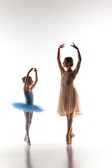 Image showing The little ballerina dancing with personal ballet teacher in dance studio