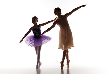 Image showing The little ballerina dancing with personal ballet teacher in dance studio