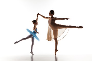 Image showing The little ballerina dancing with personal ballet teacher in dance studio