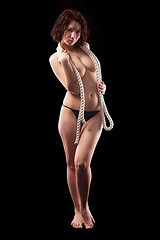Image showing Young topless woman body covering by rope
