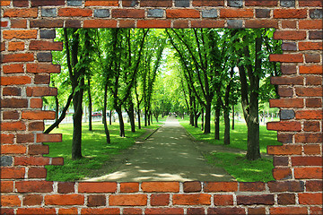 Image showing broken brick wall and view to Summer park