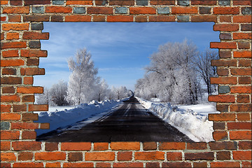 Image showing broken brick wall and view to Winter highway