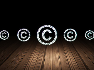 Image showing Law concept: copyright icon in grunge dark room