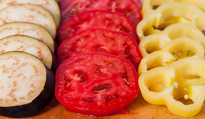 Image showing In front sliced eggplant tomato and sweet pepper