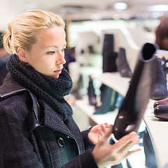 Image showing Beautiful woman shopping in shoe store.