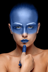 Image showing Portrait of a woman who is posing covered with blue paint