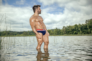 Image showing muscular man lake