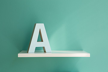 Image showing Letter A on a white shelf.