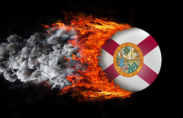 Image showing Flag with a trail of fire and smoke - Florida