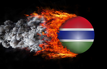Image showing Flag with a trail of fire and smoke - Gambia