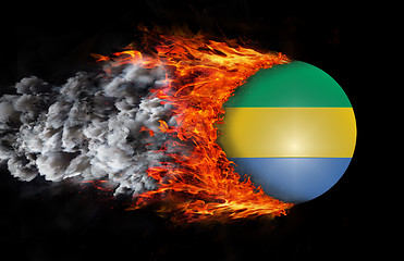 Image showing Flag with a trail of fire and smoke - Gabon