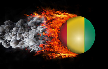 Image showing Flag with a trail of fire and smoke - Guinea