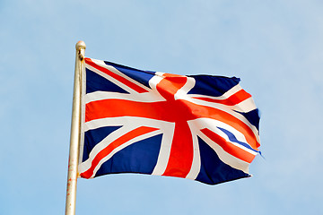 Image showing waving flag in the blue sky british 