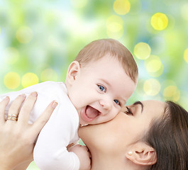 Image showing happy mother with baby over green background