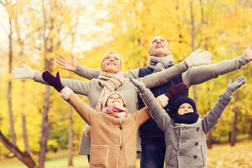 Image showing happy family having fun in autumn park