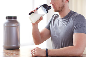 Image showing close up of man drinking protein shake