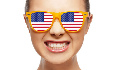 Image showing angry teenage girl in glasses with american flag