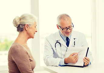 Image showing smiling senior woman and doctor meeting