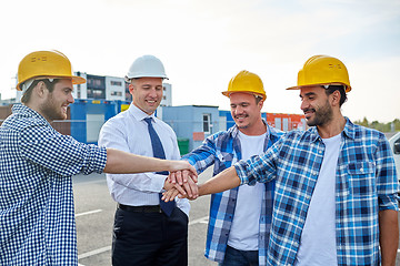 Image showing builders and architects with hands on top