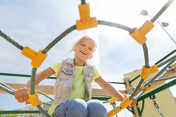 Image showing happy little girl climbing on children playground