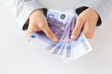 Image showing close up of woman hands counting euro money