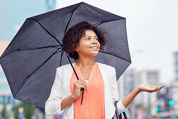 Image showing happy african american businesswoman with umbrella