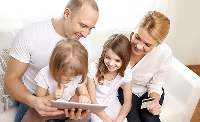 Image showing happy family with tablet pc and credit card